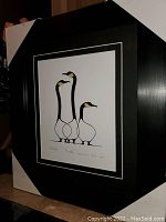 Framed artwork showing three stylized birds in black and beige on white background, titled 'Friends' by Benjamin Chee Chee.