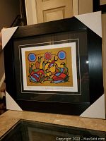 Framed and matted print of "Gathering" showing overall view with protective corners on frame.