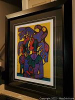 Full view of framed print showing wood frame and double mat