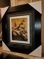 Full view of the professionally framed and matted "Pine Island" print showing the overall condition and frame with protective corner guards.