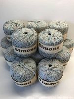 14 balls of Italian SIMONA cotton blend yarn stacked, showing labels and color details