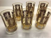 Set of six vintage tumblers shown together on a white surface, displaying the Greek goddess designs and Greek key border.