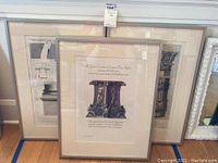 Three framed Piranesi engravings leaning against wall