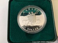 Close up of the proof dollar coin showing a ballet dancer with other dancers behind, marked CANADA, 1 DOLLAR, 2001, .925 silver