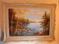 Frontal image of the oil painting showing the full landscape scene and ornate frame