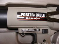 Close-up of Porter Cable brand and Bammer model label on the tool body
