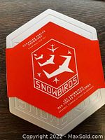 Metal hexagonal case with red sleeve labeled Canadian Forces Snowbirds Stamp and Coin Set