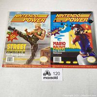 Front covers of the two Nintendo Power magazines side by side showing issue 38 with Street Fighter 2 and issue 39 with Mario Paint design.