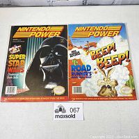 Front view of two Nintendo Power magazines side by side, Volume 42 and Volume 43, showing the covers and titles clearly.