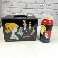 Front view of the vintage 1963 Barbie vinyl lunchbox showing colorful illustrations of Barbie and friends with the matching thermos featuring Barbie and Midge.
