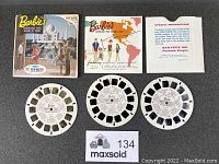 View of all components: box, three reels, instruction leaflet, story booklet