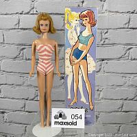 Full front view of Midge doll on stand wearing pink and white striped swimsuit next to original illustrated box placed vertically.