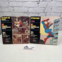 Two original boxes of 1977 vintage talking View-Master reel sets featuring Marvel Spider-Man and The New Zoo Revue.