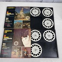 Two boxed sets of vintage GAF talking Viewmaster reels. Top box is Walt Disney World Magic Kingdom with 3 reels visible outside box. Bottom box is Charlottes Web with 3 reels arranged alongside.
