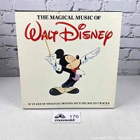 Front of box showing The Magical Music of Walt Disney with Mickey Mouse conductor illustration.