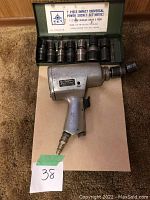Blue-Point impact wrench and Jet 7-piece metric socket set in metal case.