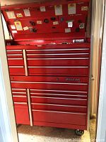 Front view of red Snap-on two-piece tool chest and cabinet stacked