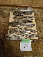 Overview of all seven locking pliers arranged on board