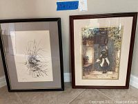 Two framed prints leaning against a wall on the floor, one sketch of bird on nest in reeds, other colored of girl by door