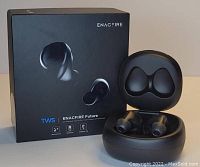 EnacFire Future earbuds in open charging case next to original black box with product branding and image.