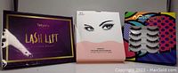 Photo of three boxed and blister-packaged eyelash and lash lift beauty products.