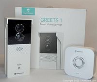 Photo showing HeimVision Greets 1 smart video doorbell, chime unit, and original box packaging.