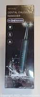 Photo of Shvyog Dental Calculus Remover packaging, showing a black handheld device with LED indicators and water splash graphics, highlighting water resistance and removal capabilities.