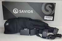 Photo of Savior branded box, black XL/2XL unpadded heated glove, two batteries, and charger with USB cable.