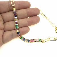 Close-up image showing the multi-colored baguette cubic zirconia stones set in gold plated brass in the necklace.