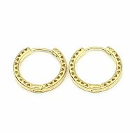 Close-up image of gold plated hoop earrings showing heart cut out details on a white background.