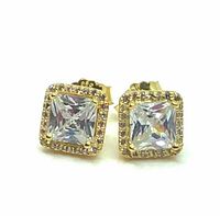 Close up front angle of the pair of gold plated sterling silver stud earrings with princess cut cubic zirconia.