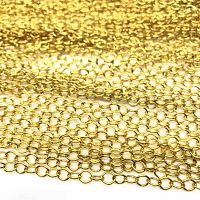 Multiple gold plated chains laid out to show quantity and length