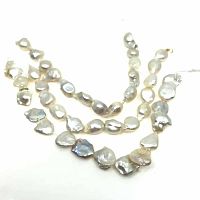 Photo of strands of irregularly shaped white freshwater baroque pearls, showing their lustrous surface and unique shapes.