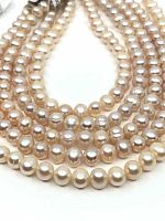 Five pink freshwater pearl strands arranged side by side