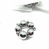 Close-up of six 8mm white gold plated magnetic clasps arranged in a circle to show spherical shape and split design.