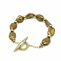 Close-up view of bracelet showing irregular natural Keshi pearls in golden bronze hues with gold plated pave CZ toggle clasp.