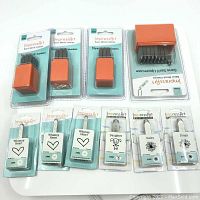 Overview of ImpressArt metal hand stamps for letters, numbers, hearts, daisies, and Daughter design in packaging.