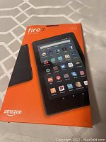 Front of sealed Amazon Fire 7 tablet box showing the device and branding.