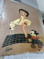 Full print of Betty Boop standing on a grate with two dogs, on a speckled colored background with signature visible, showing condition and artwork details.