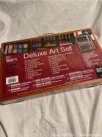 Back of the Deluxe Art Set box listing contents and components included in the 80 piece art set.