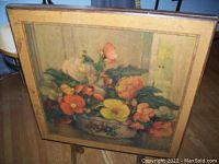 Top view of the vintage card table showing the floral painting by Max Streckenbach