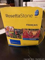 Yellow Rosetta Stone French learning box labeled 'Français Totale' on front, in fair condition.