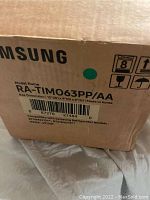 Photo of the original Samsung branded cardboard box with model RA-TIM063PP/AA and compatibility details.