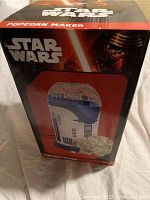 Front view of box showing the R2-D2 popcorn maker graphic and Star Wars branding