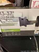 Box of TV wall mount for 13-37 inch TVs showing product info and packaging condition.