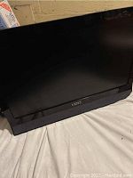 Front view of the Vizio 24-inch flat screen TV showing the black screen and Vizio logo on the bottom bezel.