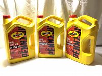 Three yellow 5L containers of Pennzoil High Mileage SAE 10W-30 motor oil shown from the front and side views.