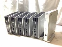 Front and side view of five thin client units arranged together showing model design and connectivity ports.