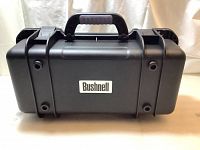 Front view showing Bushnell logo on the rigid black case exterior with protective ribbing.