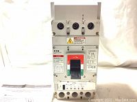 Front view of an Eaton LG-frame circuit breaker L630H showing the toggle switch and front labels.